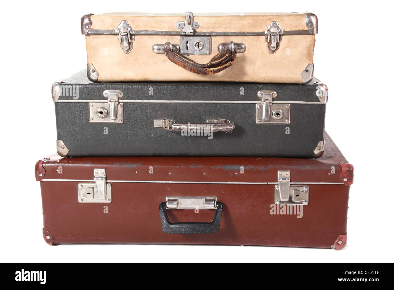 three old dirty dusty suitcases. all suitcases is closed. Isolated. Stock Photo