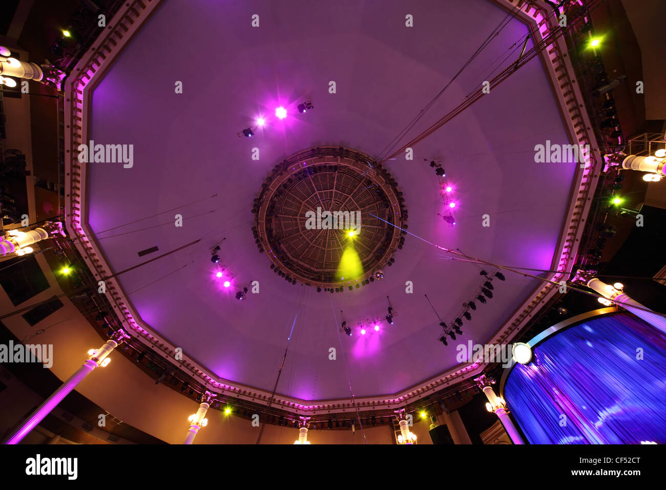 circus interior view on celling with pink light lamps and blue curtain Stock Photo