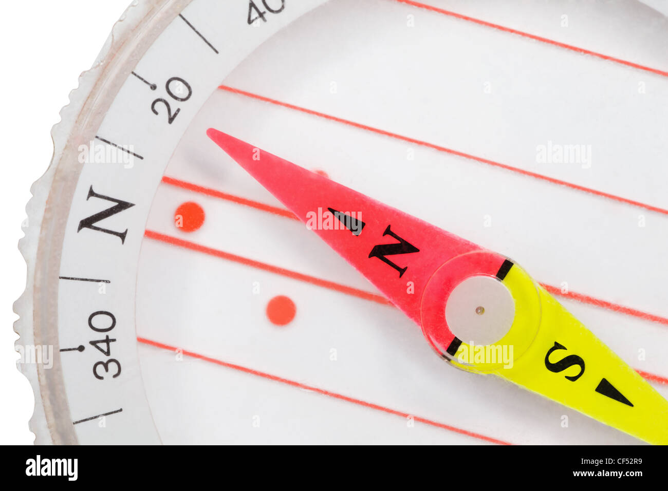 Fragment of plastic compass with an arrow specifying in north isolated on white background Stock Photo