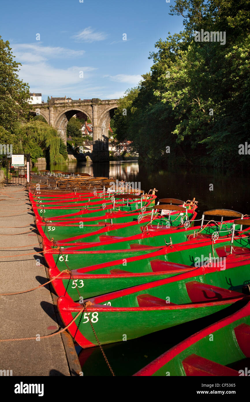Rowing boats for hire on the River Nidd. The Knaresborough Viaduct