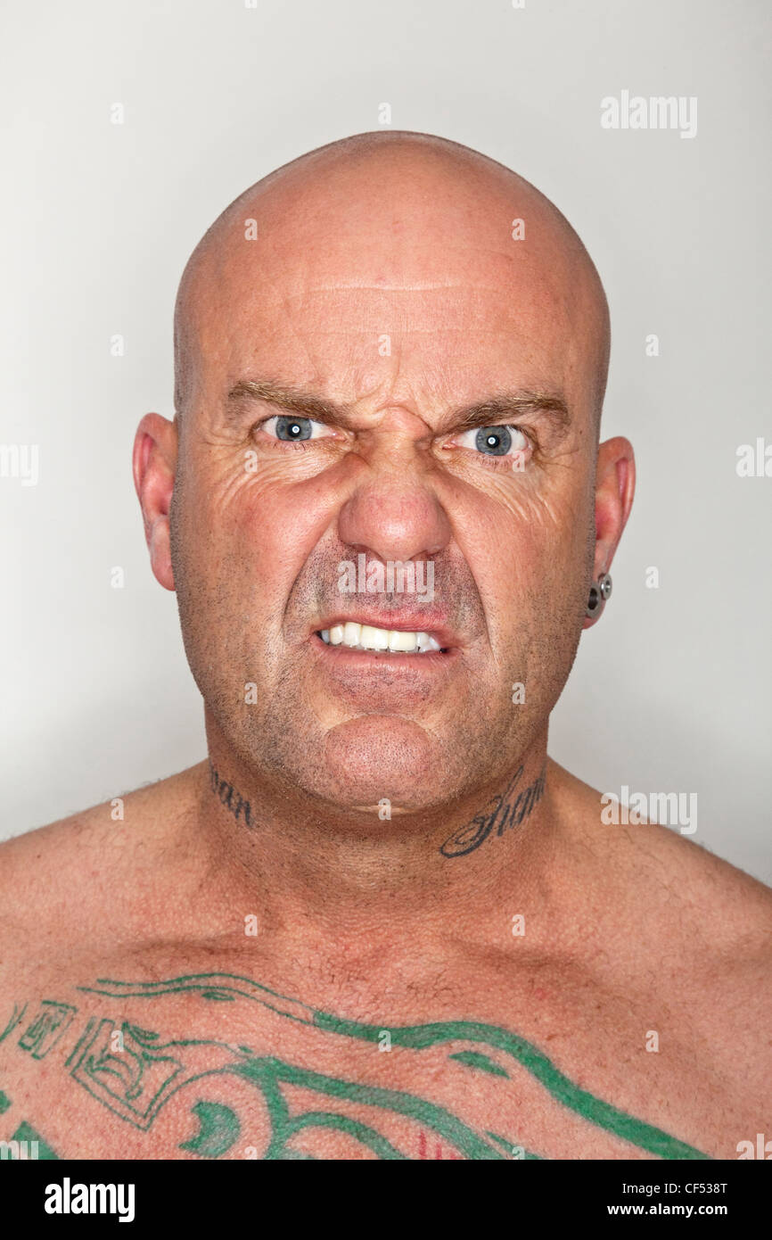 portrait of a man looking menacing Stock Photo