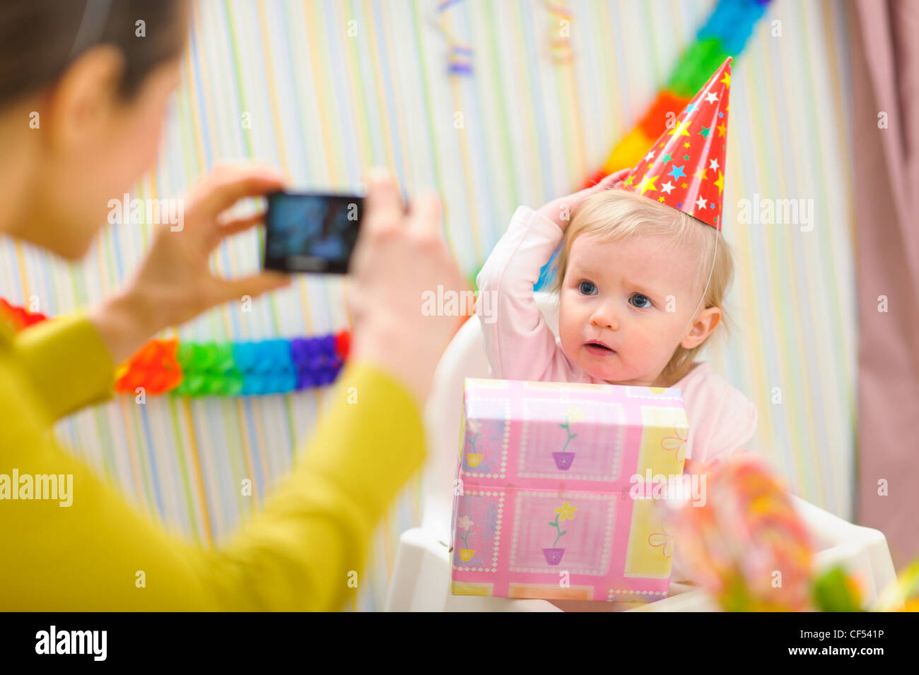 Mother making photos of babys first birthday Stock Photo Alamy