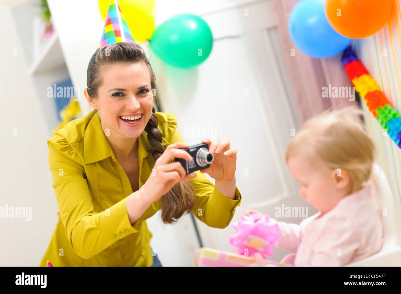 Mother making photos of babys first birthday Stock Photo Alamy