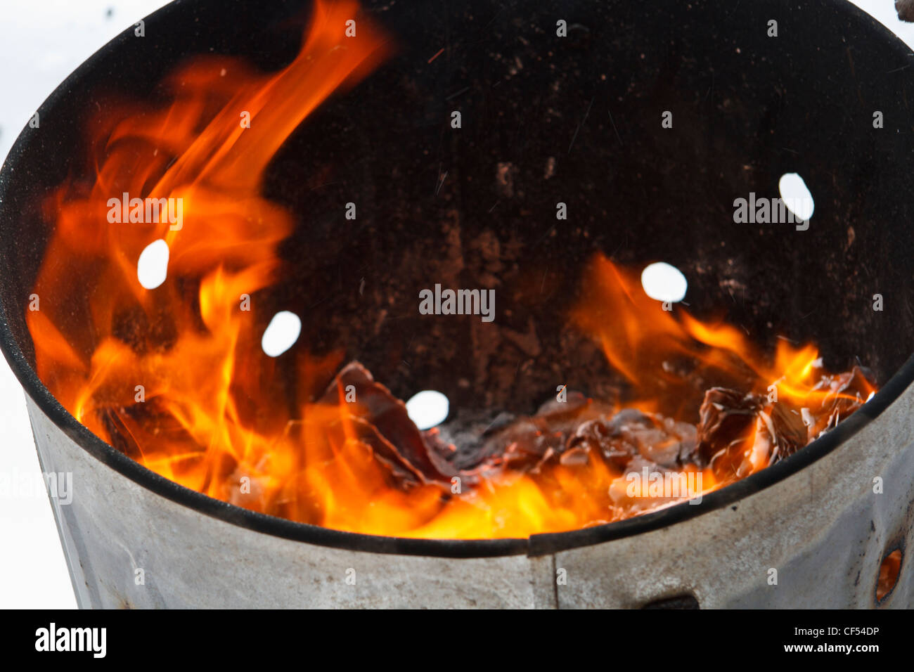 Garden incinerator in the snow Stock Photo - Alamy
