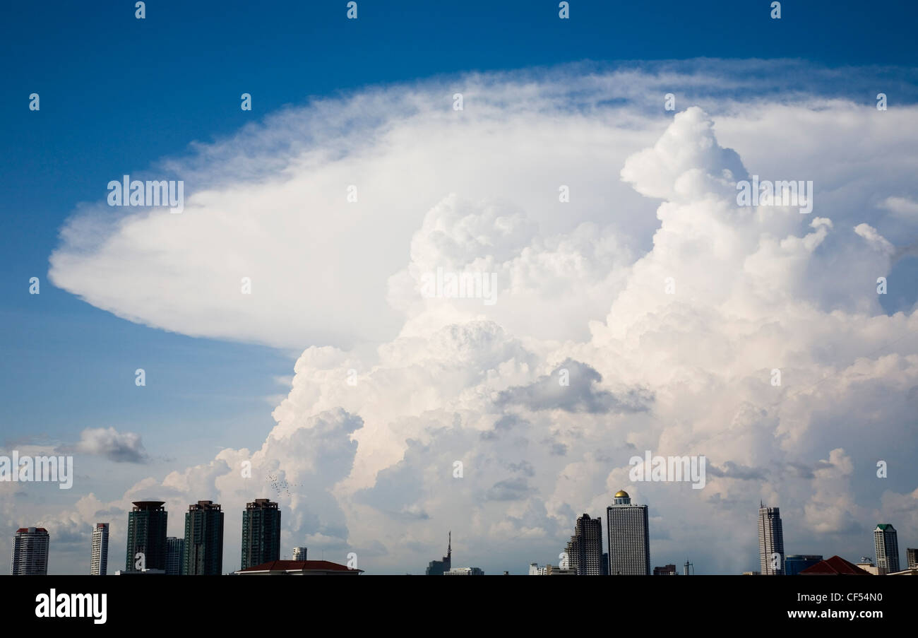 Thailand, Bangkok, Cumulonimbus cloud formation over central area of the capital city. Stock Photo
