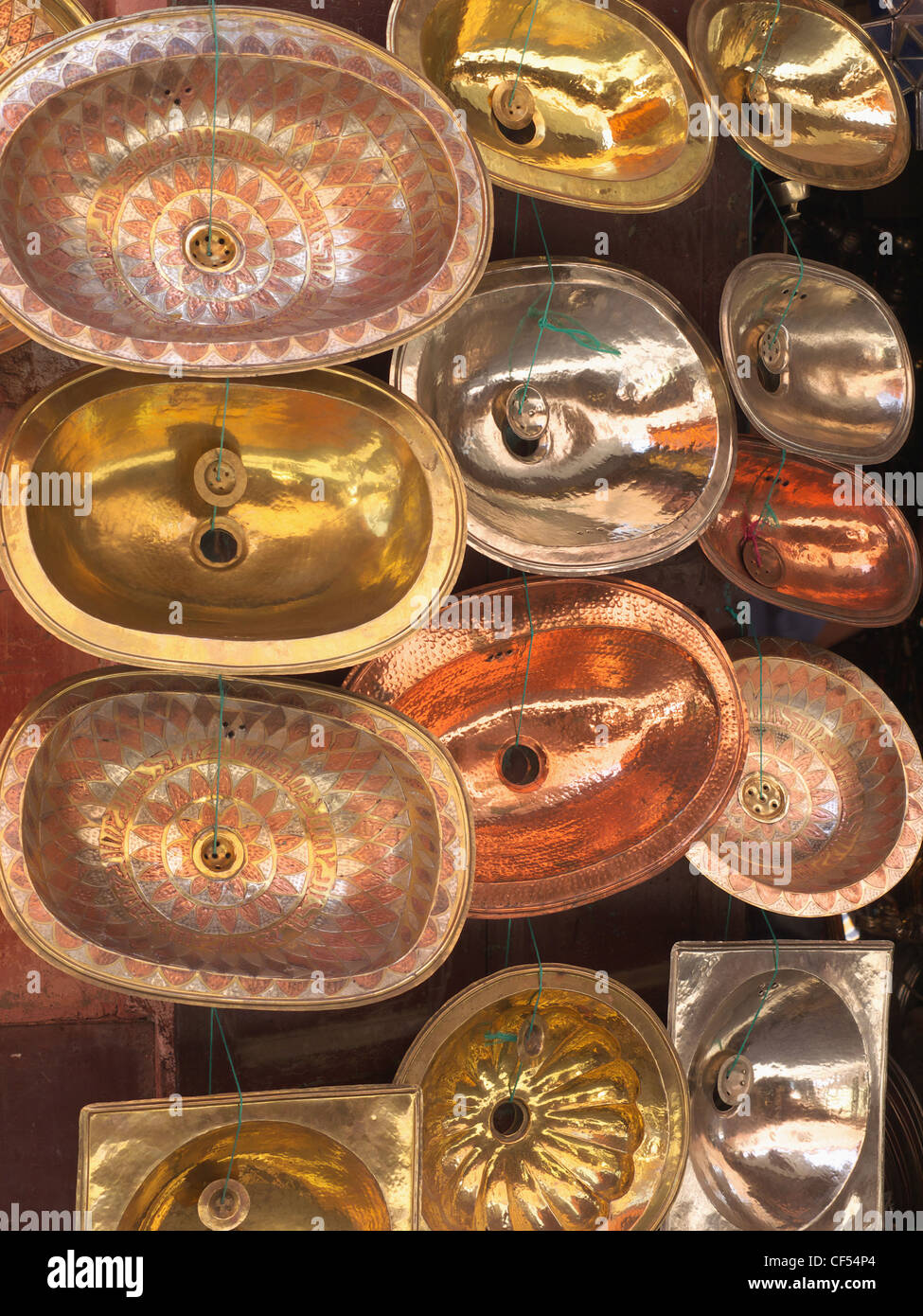 Morocco, Essaouira, Variety of copper wash bowls in shop at souk Stock Photo