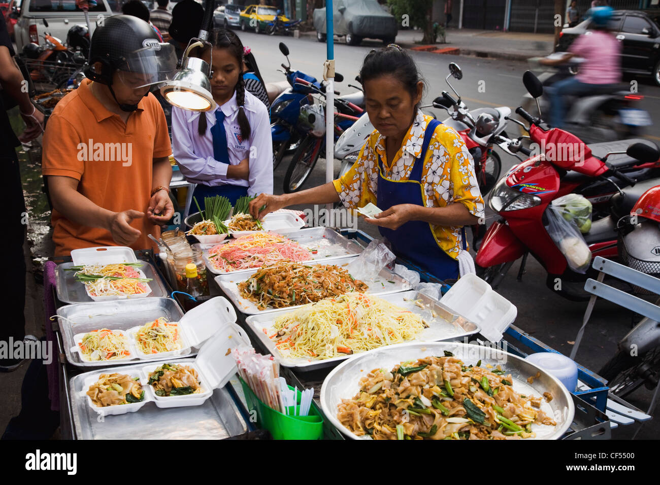 Thailand, Bangkok, Street vendor sells take away Padthai the national