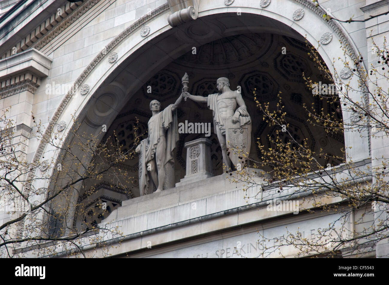 Looking up to statues above the entrance to BBC Bush House in Aldwych