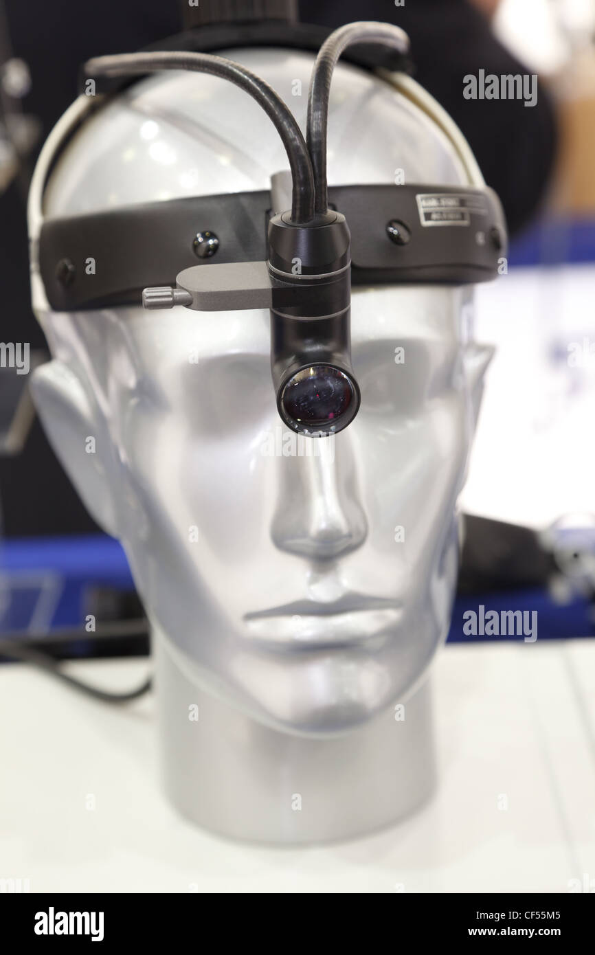 Medical headlight on the head of the dummy. Medical Equipment. Vertical