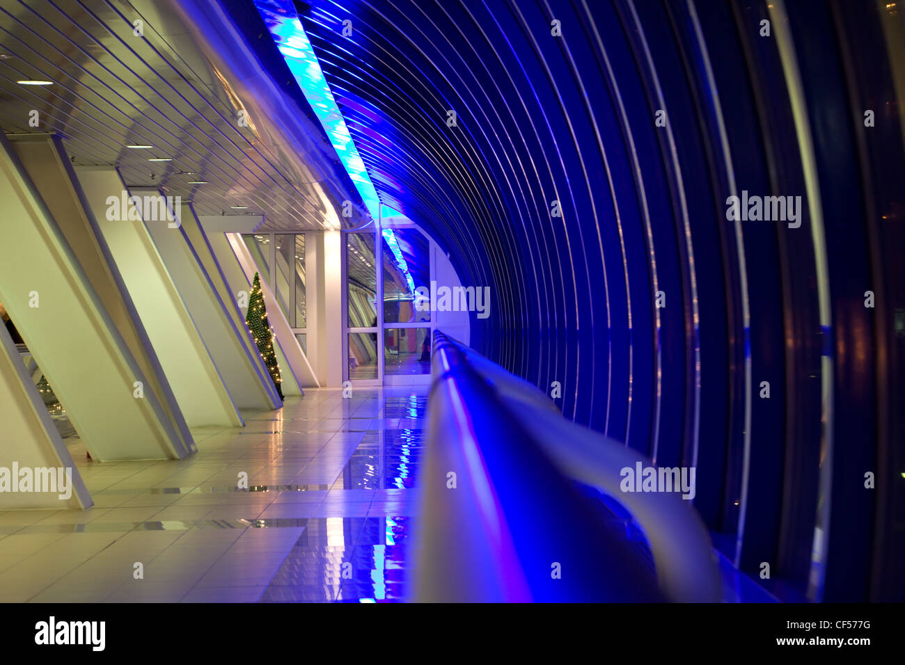 Long corridor with big windows in modern building at night Stock Photo