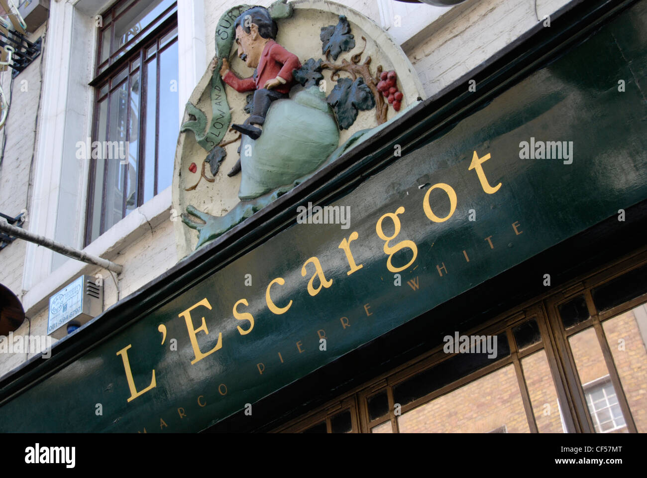 The signage for Marco Pierre Whites L'Escargot restaurant on Greek Street. Stock Photo