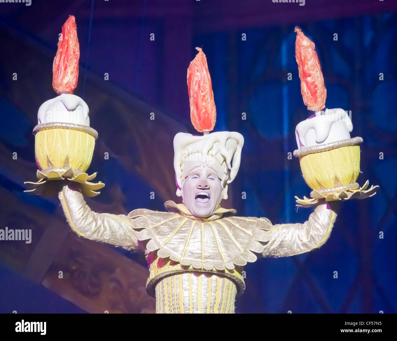 Lumiere the singing candlestick from Beauty and the Beast sings to the audience at the Disney Princesses show in Green Bay Stock Photo