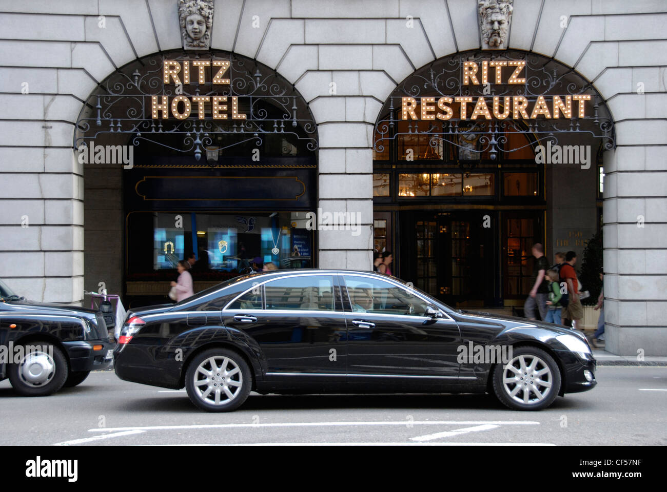 A luxurious black limousine outside the Ritz Hotel in Piccadilly. Stock Photo