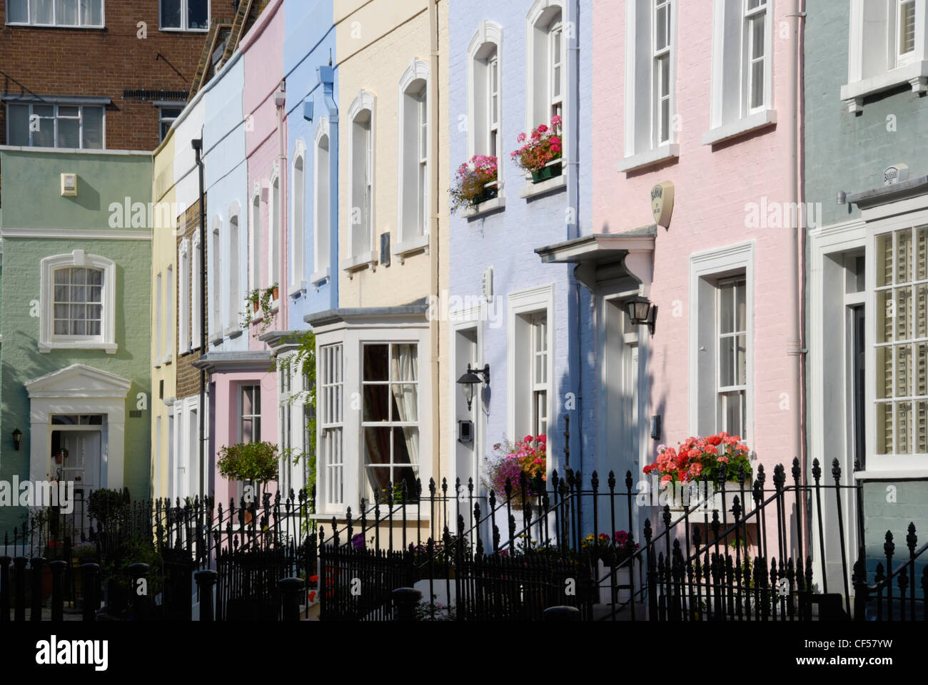 A row of colourful Georgian houses on Bywater Street in Chelsea. Stock Photo
