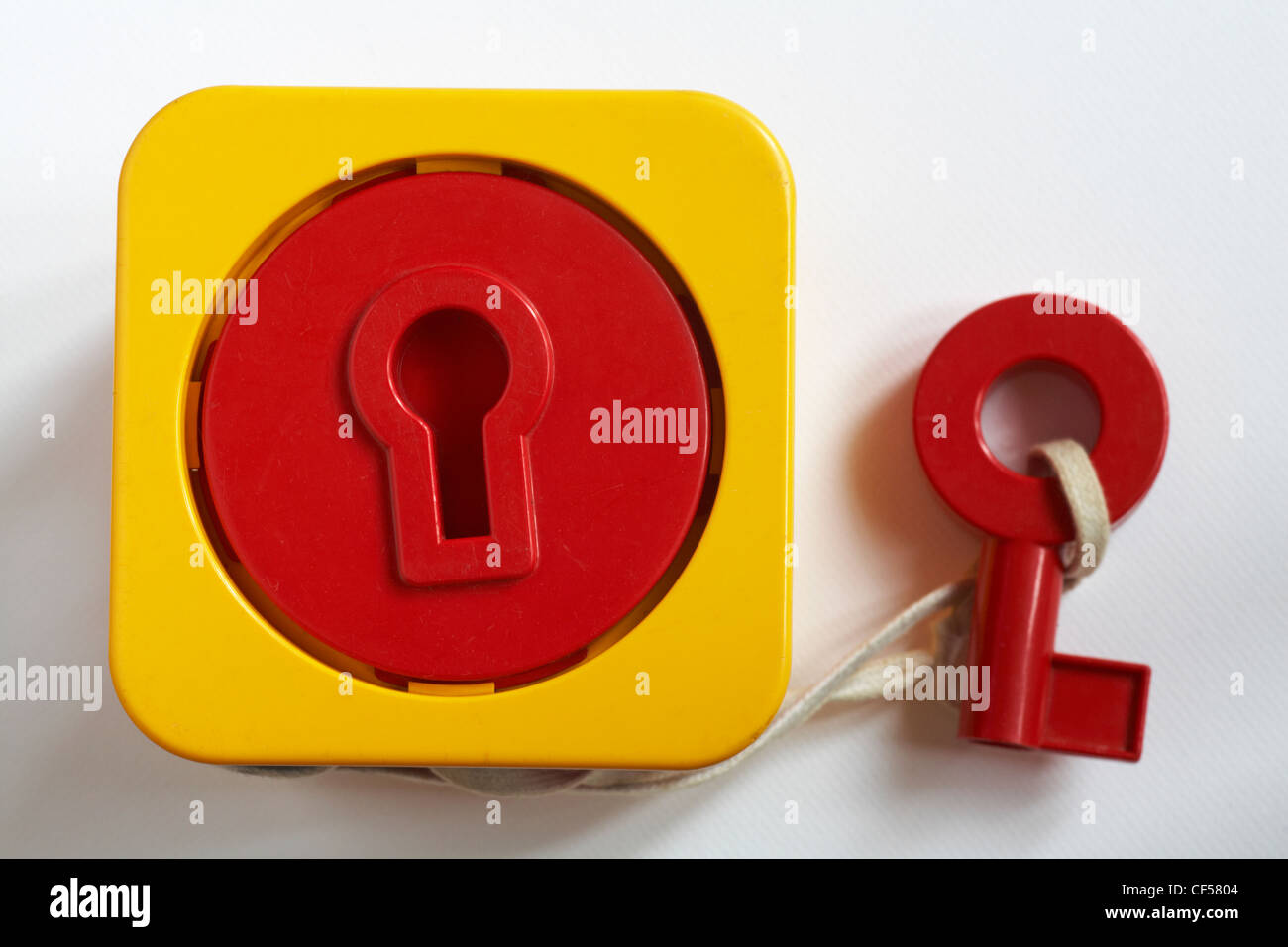 child's coordination toy to get key in lock isolated on white background Stock Photo