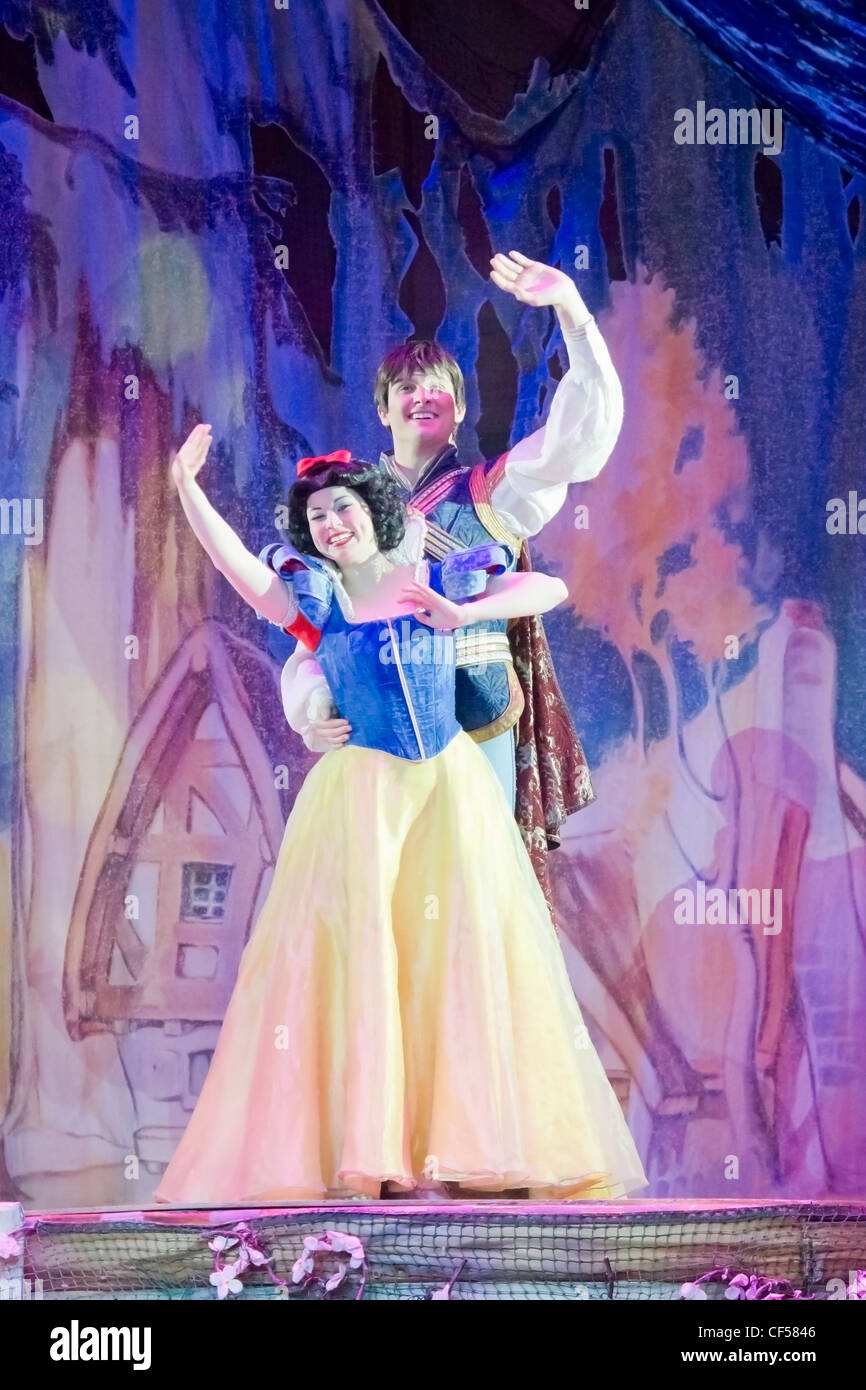 Snow White and Prince Charming stand and wave to the crowd at the Disney Princesses show at the Resch Center in Green Bay Stock Photo