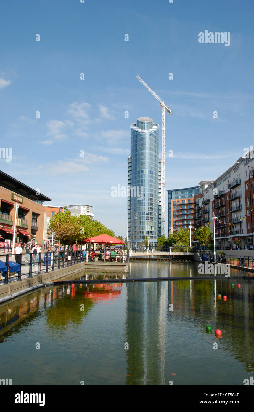 A view of Gunwharf Quays showing a crane next to the Number One Tower. Stock Photo