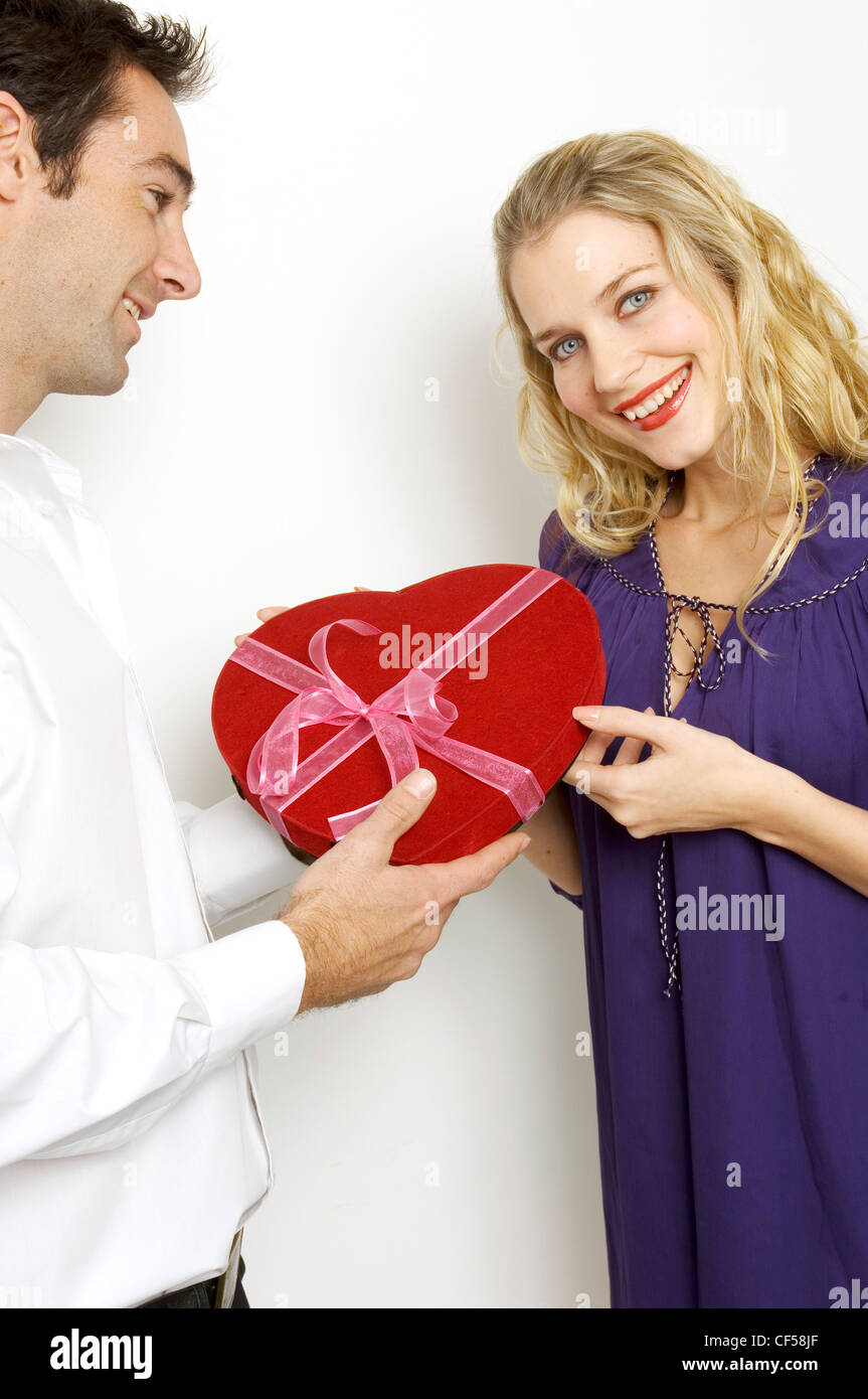 Female Curly Blonde Hair Wearing Purple Smock Top Male Short