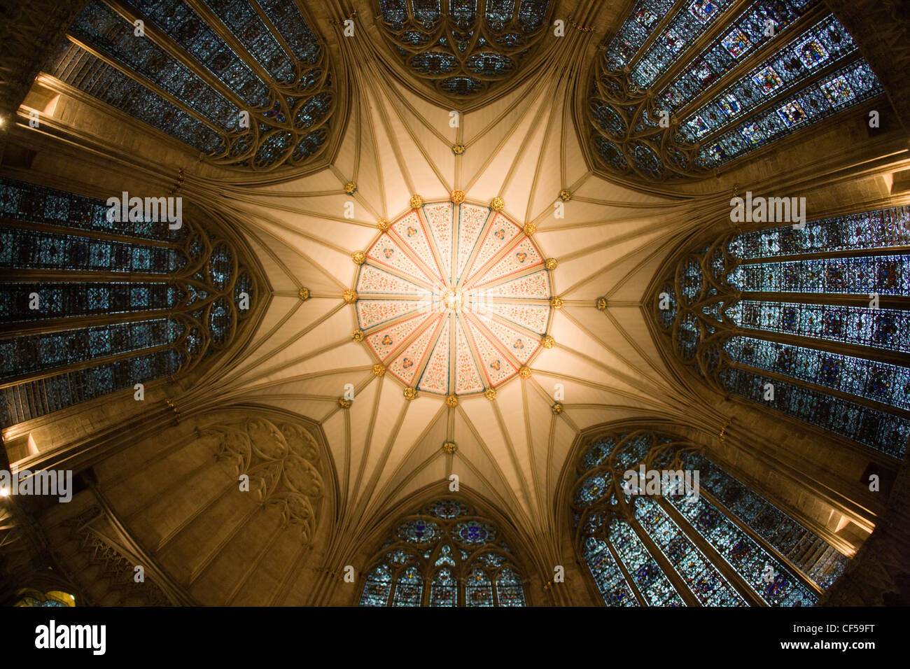 The beautiful fan-vaulted ceiling and stained glass windows in the Chapter House, York Minster, York Stock Photo