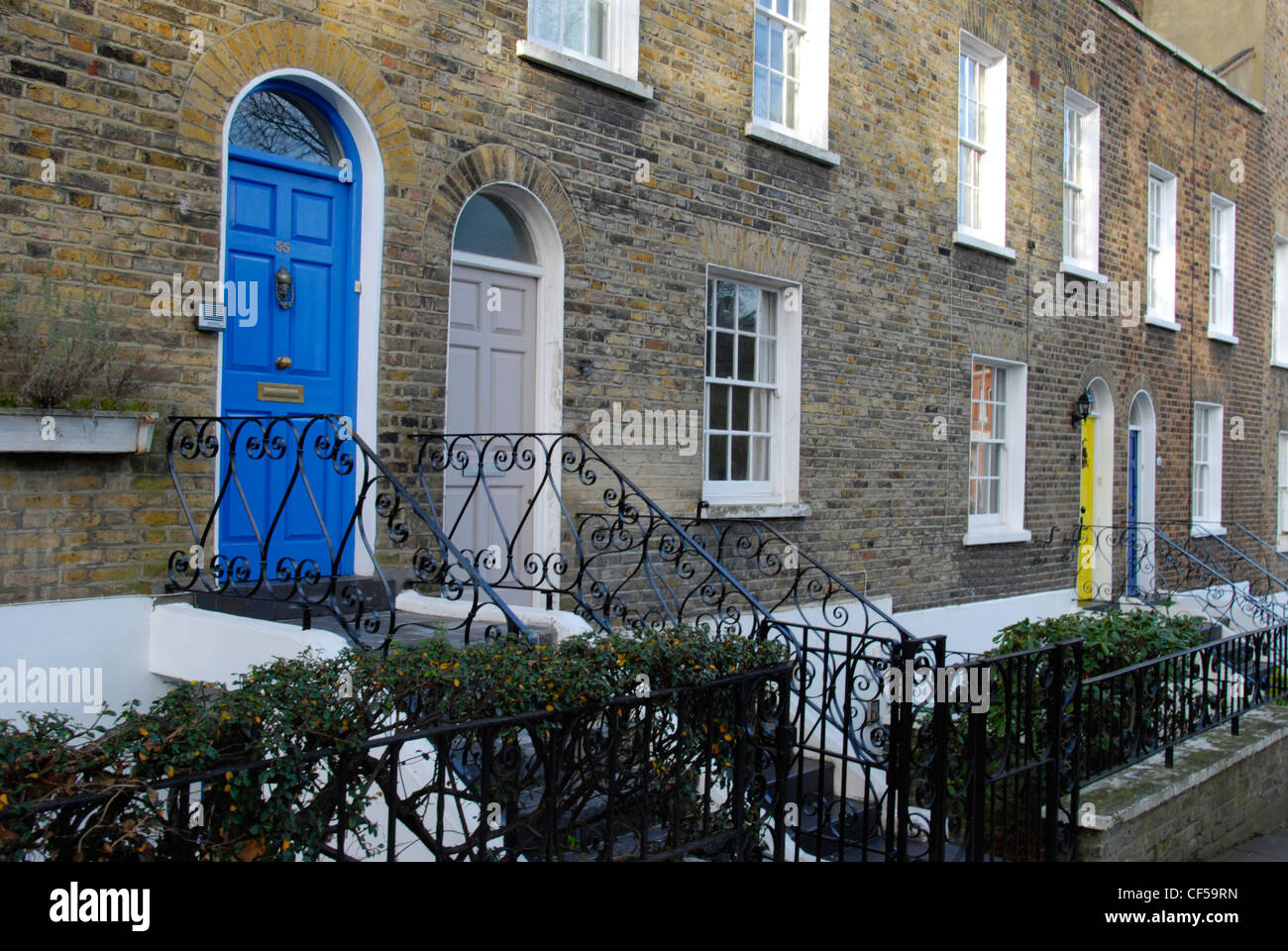 Colourful doors on the front of terraced houses in Flask Walk Stock