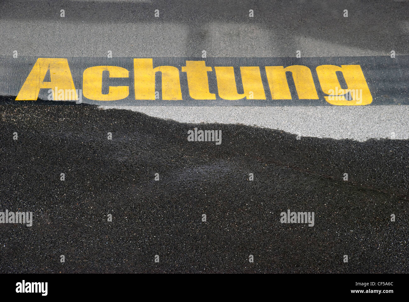 Germany, Text written on asphalt, close up Stock Photo