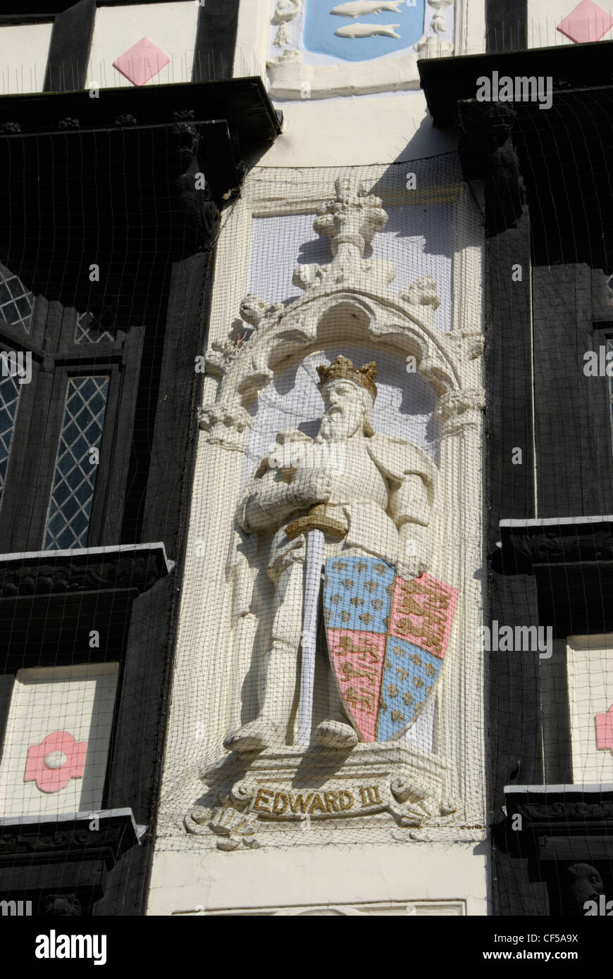 A Statue of Edward III on a mock Tudor exterior of Next department store building in Kingston. Stock Photo