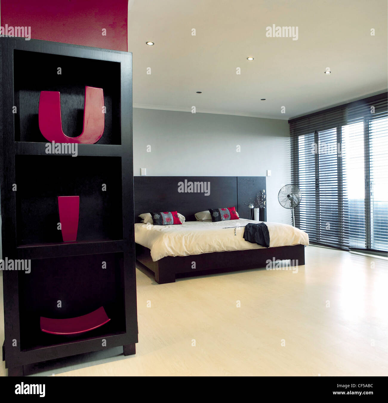 A Spacious Black Cream And White Themed Bedroom Featuring A