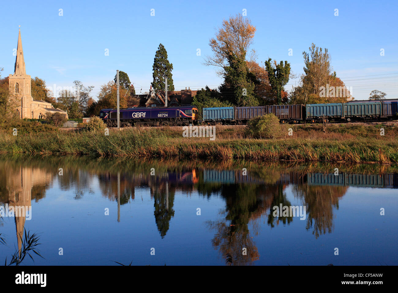 GBRF 66724 Diesel Powered Freight Train Pulling Containers, East Coast Main Line, River Great Ouse, Offord Cluny Cambridgeshire Stock Photo