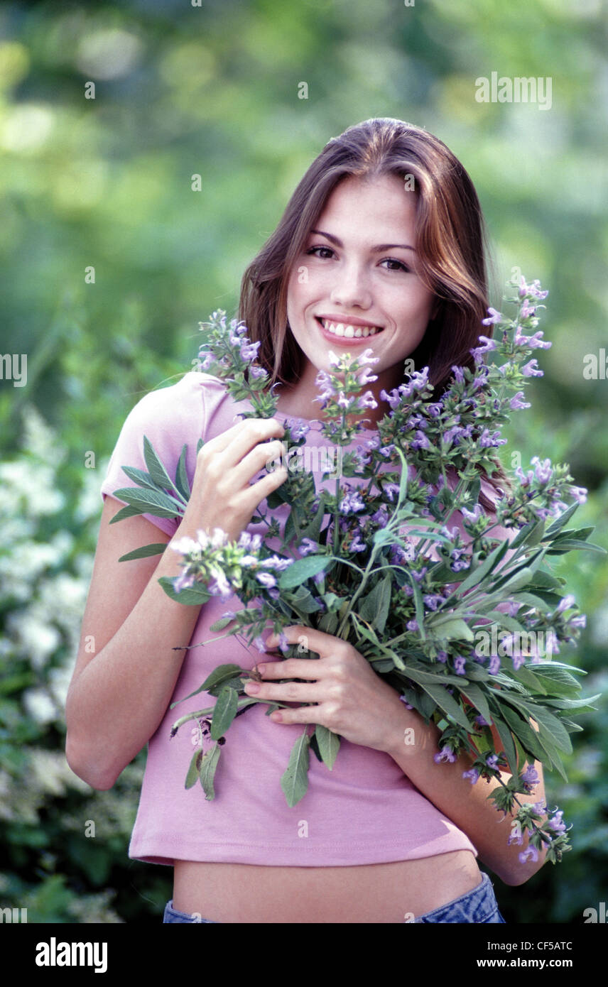Female holding flowers Stock Photo Alamy