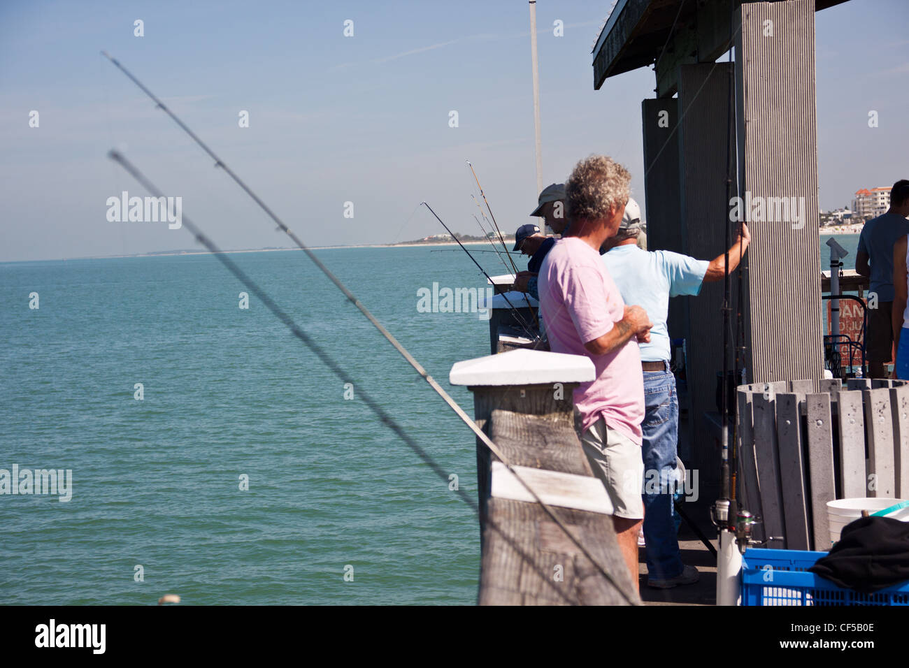 fishing from pier at clearwater beach florida,sea fishing,fishing rods,pier  fishing Stock Photo - Alamy