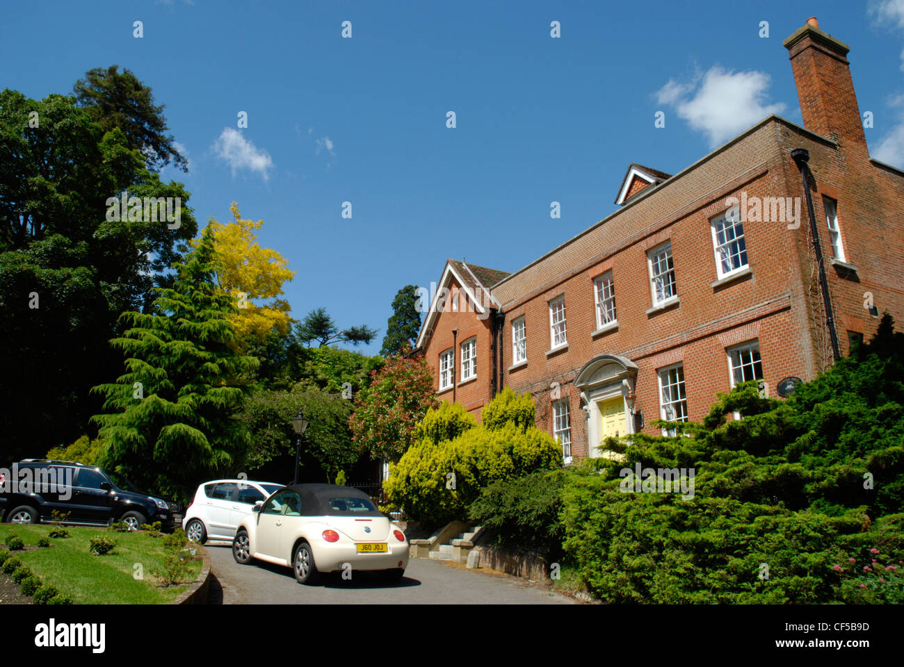 Cars parked outside a red bricked house on Castle Street in