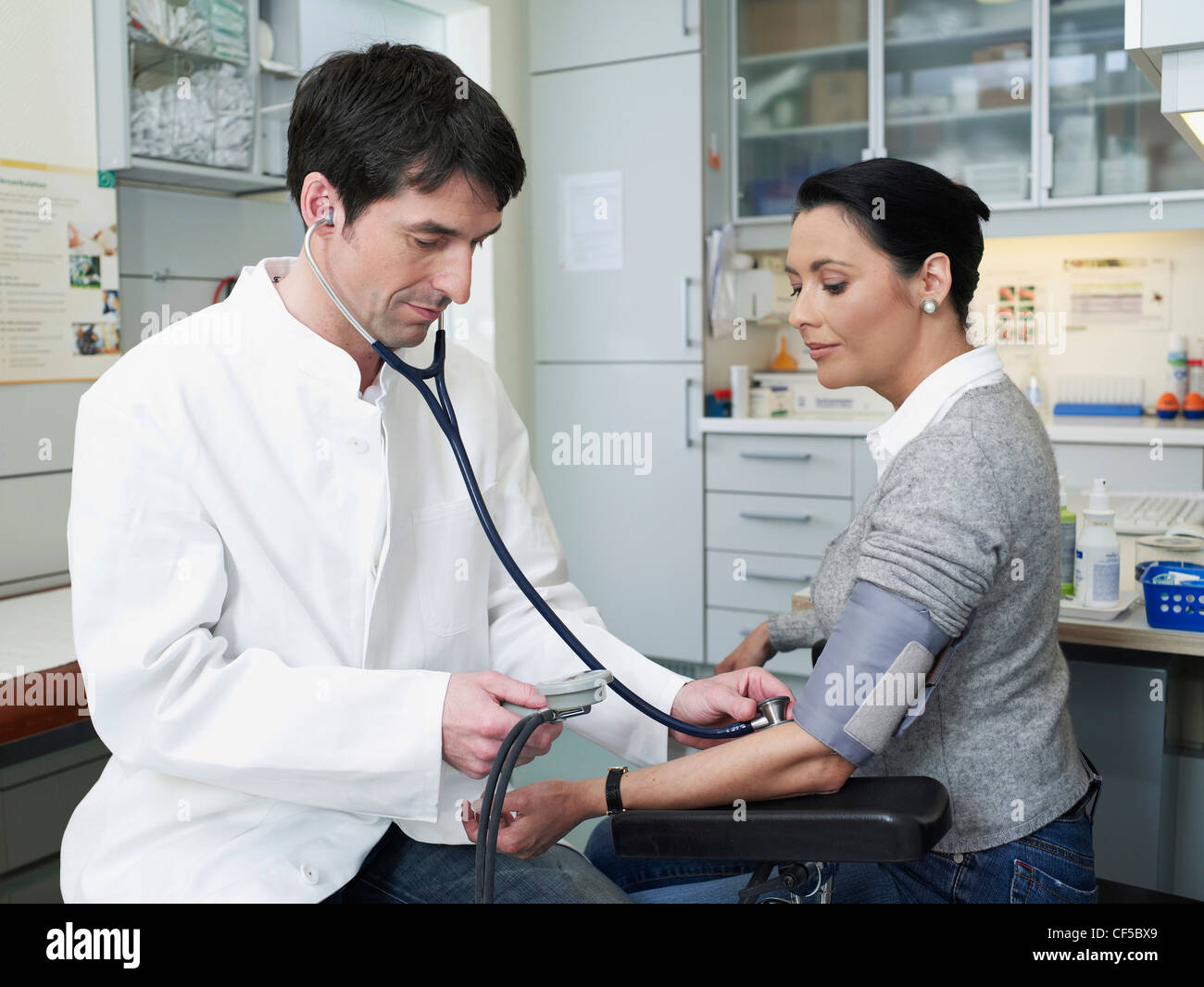 Two men only doctor blood pressure hi-res stock photography and images ...