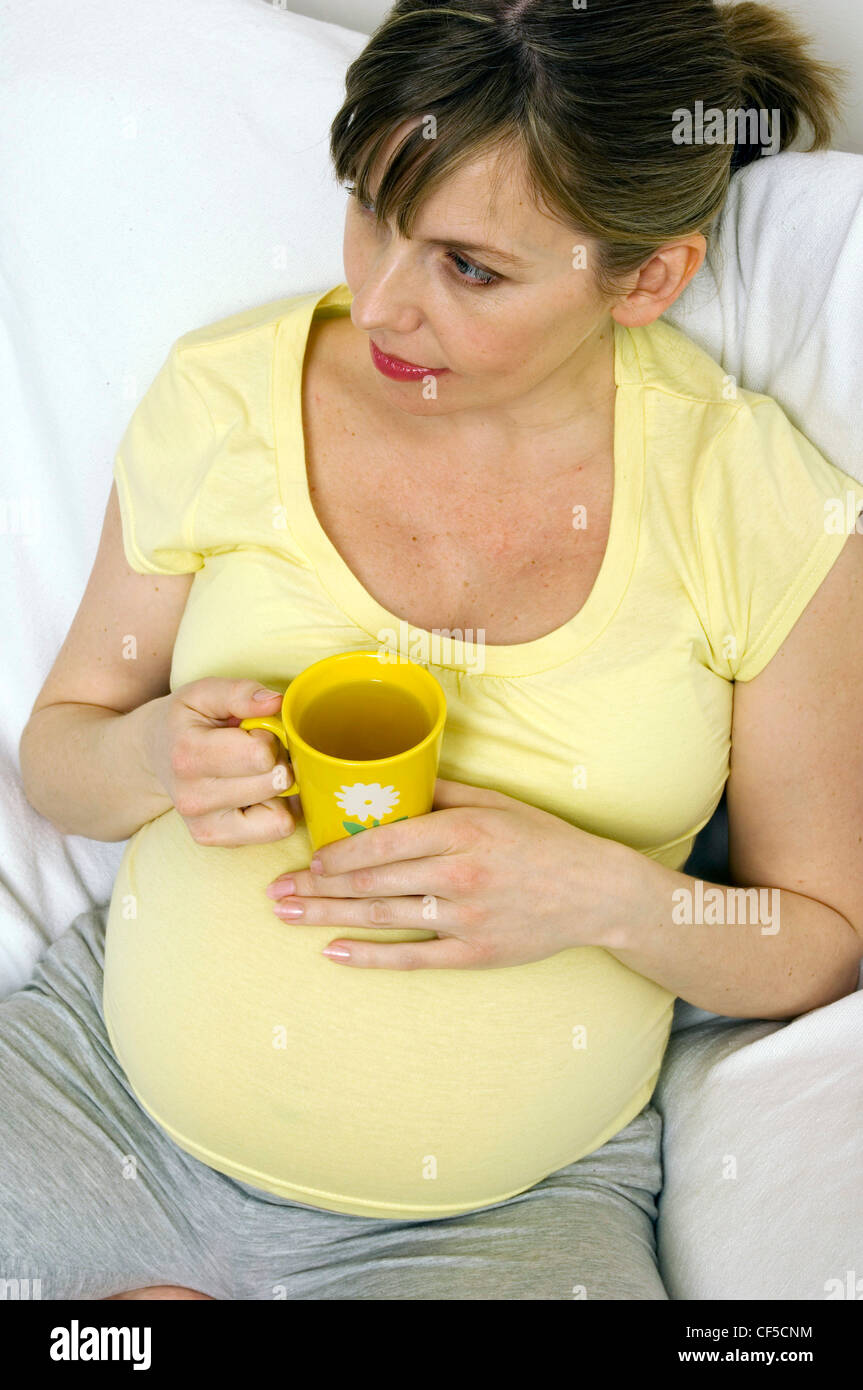 Pregnant Female drinking a cup of tea Stock Photo Alamy