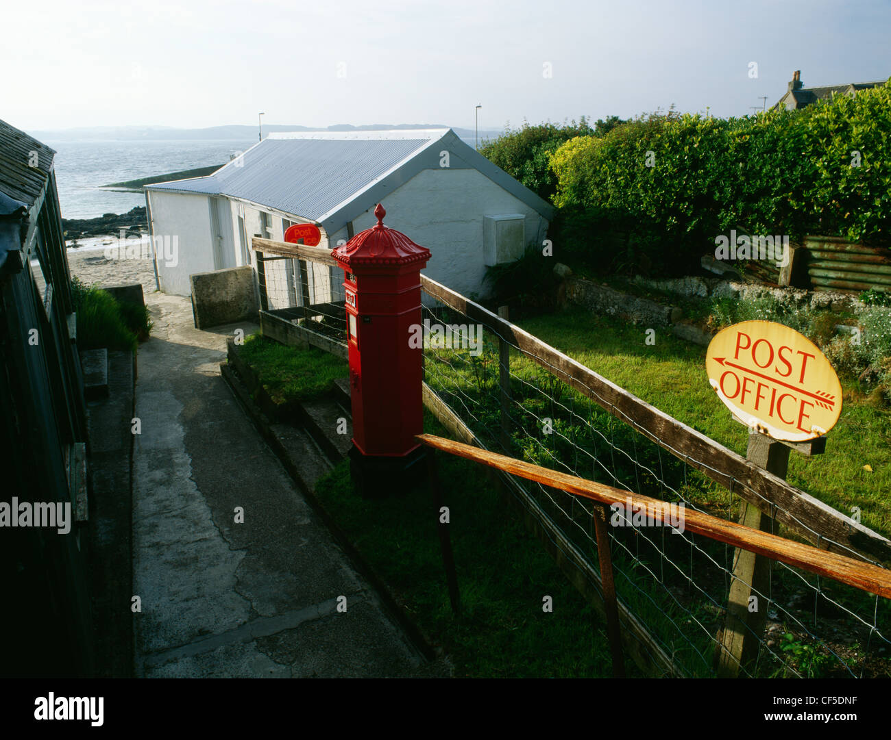 The village post office at Baile Mor overlooking St Ronan's Bay and the Sound of Iona. Stock Photo
