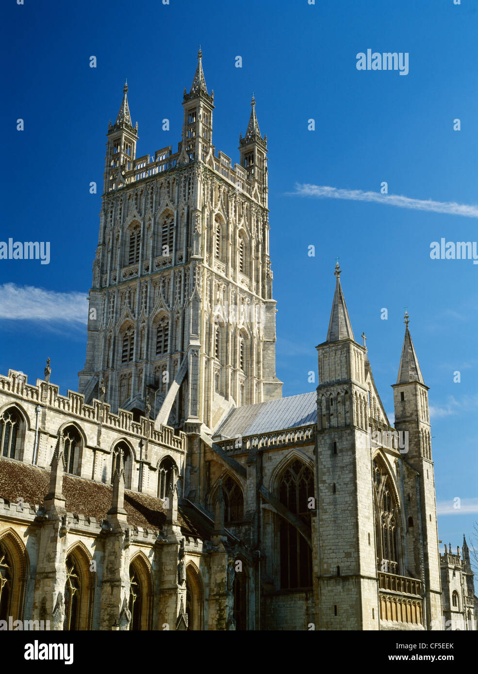 The Perpendicular central tower and Norman south transept turrets of Gloucester cathedral, the former Benedictine abbey church o Stock Photo