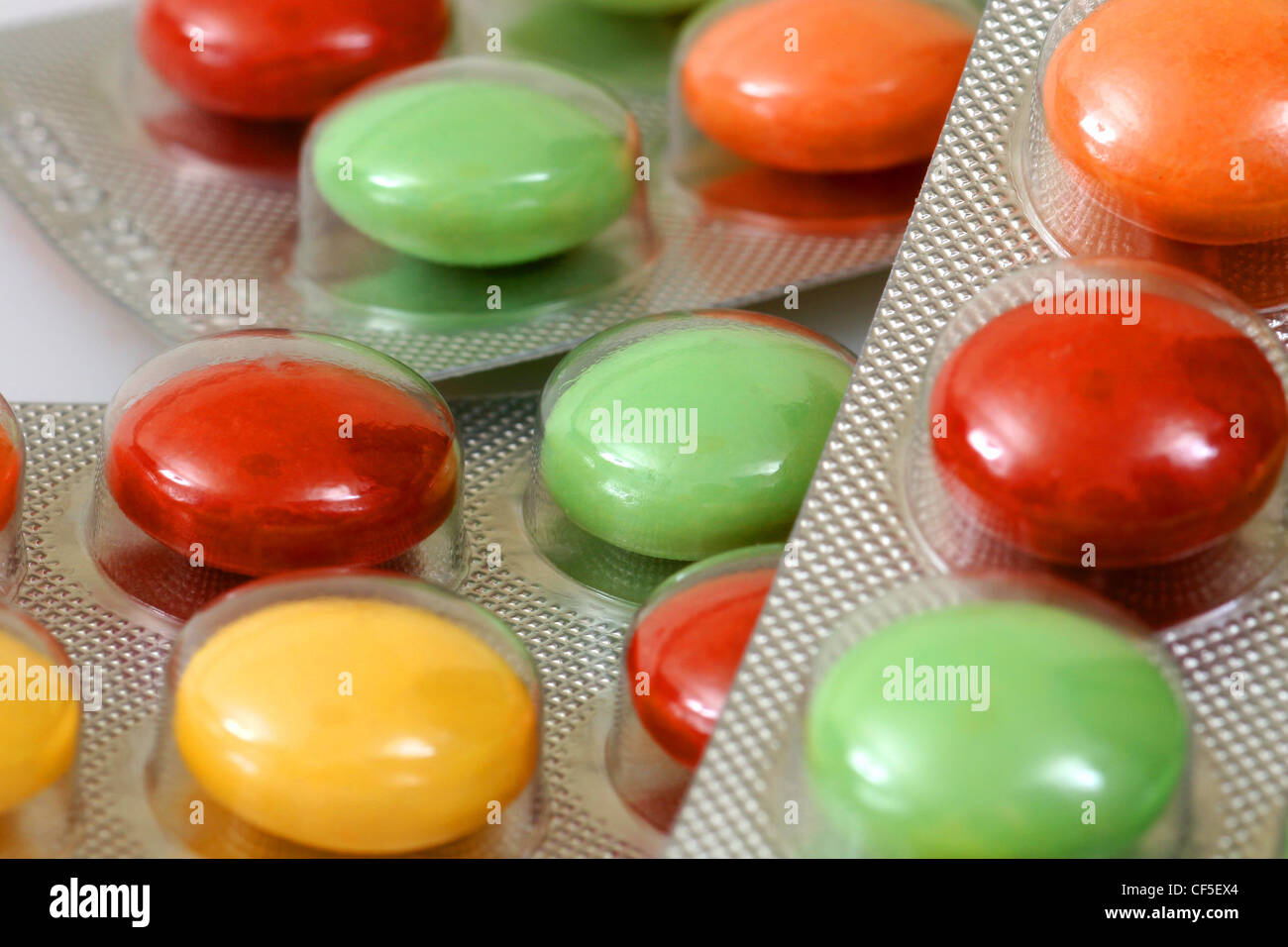 Blister tablet packets with red, yellow and green tablets inside it