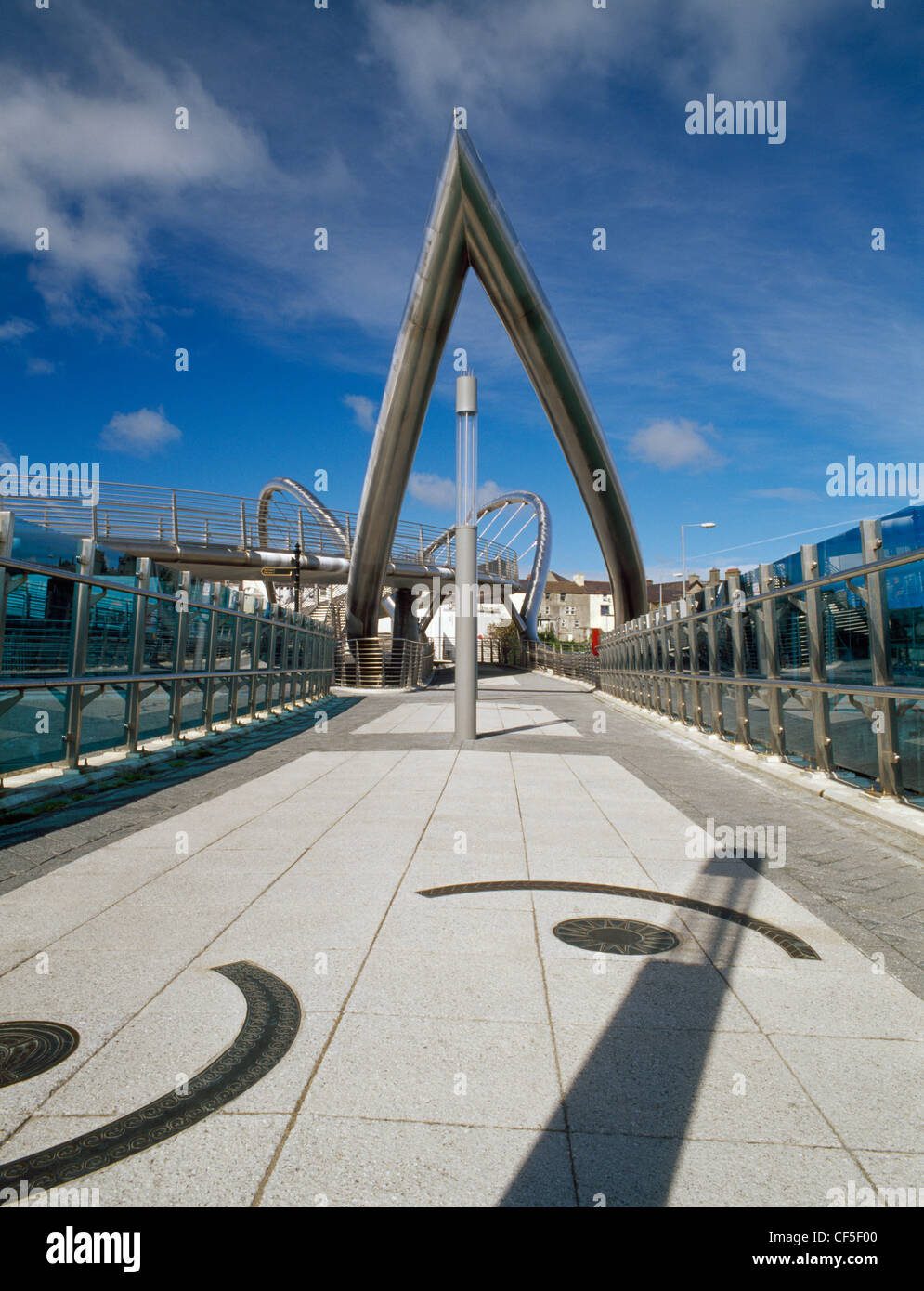 The main walkway and stainless steel arch of the Celtic Gateway bridge, opened 19 October 2006, linking the ferry terminal and r Stock Photo