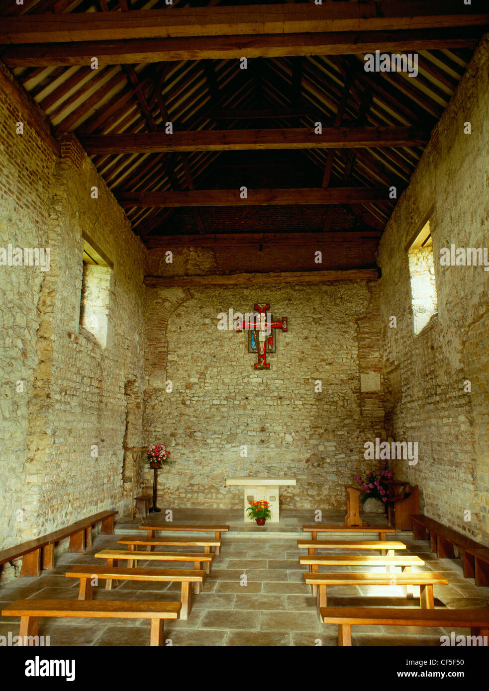 Interior of the nave of St Peter's 7th-century chapel, built of reused Roman materials on the site of Othona Roman fort. It form Stock Photo