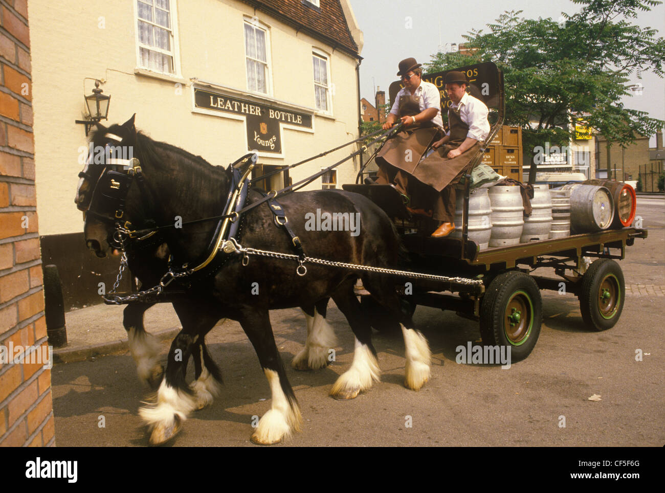 Youngs Brewery horse and cart Wandsworth traditional delivery of beer to local pub Leather Bottle in the Kingston Road, South Wimbledon.  England 1980s circa 1985 UK HOMER SYKES Stock Photo