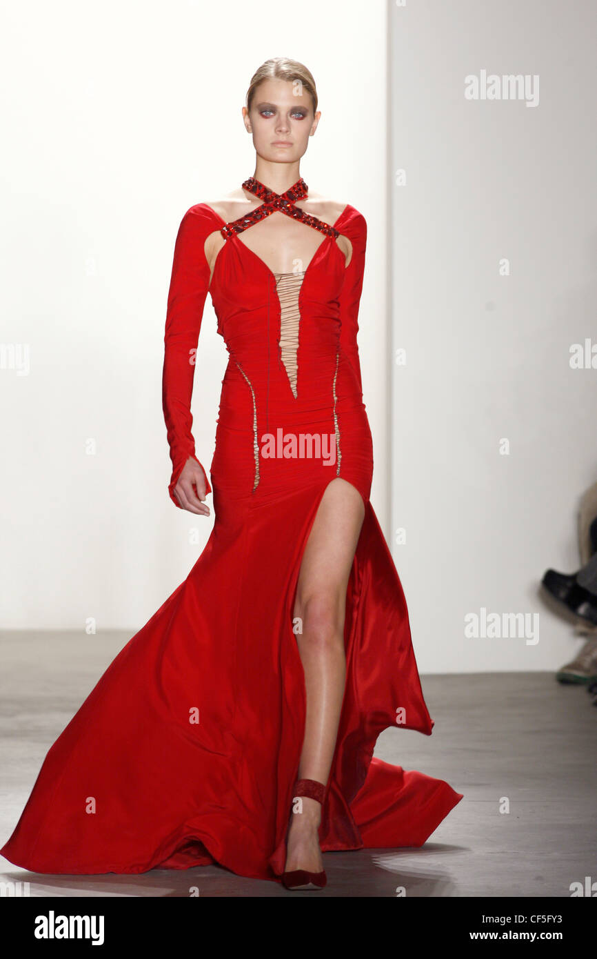 Altuzarra New York Ready to Wear Autumn Winter Red flolength dress long sleeves cut out armpits embellished halterneck thigh Stock Photo Alamy