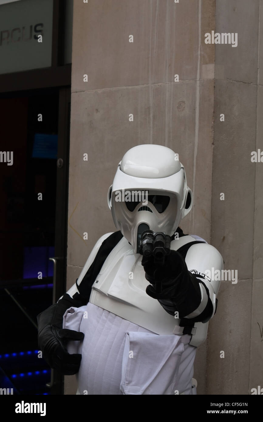 A Storm Trooper from Star Wars saga pointing a gun Stock Photo