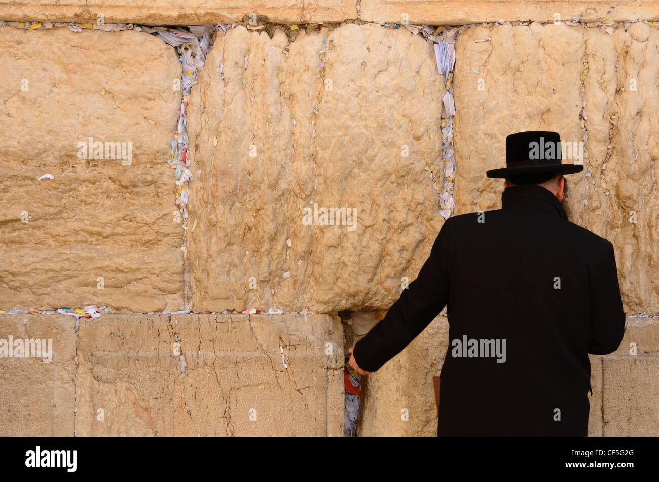 A Hasidic Jew prays at the wailing wall in the Old City of Jerusalem, Israel. Stock Photo