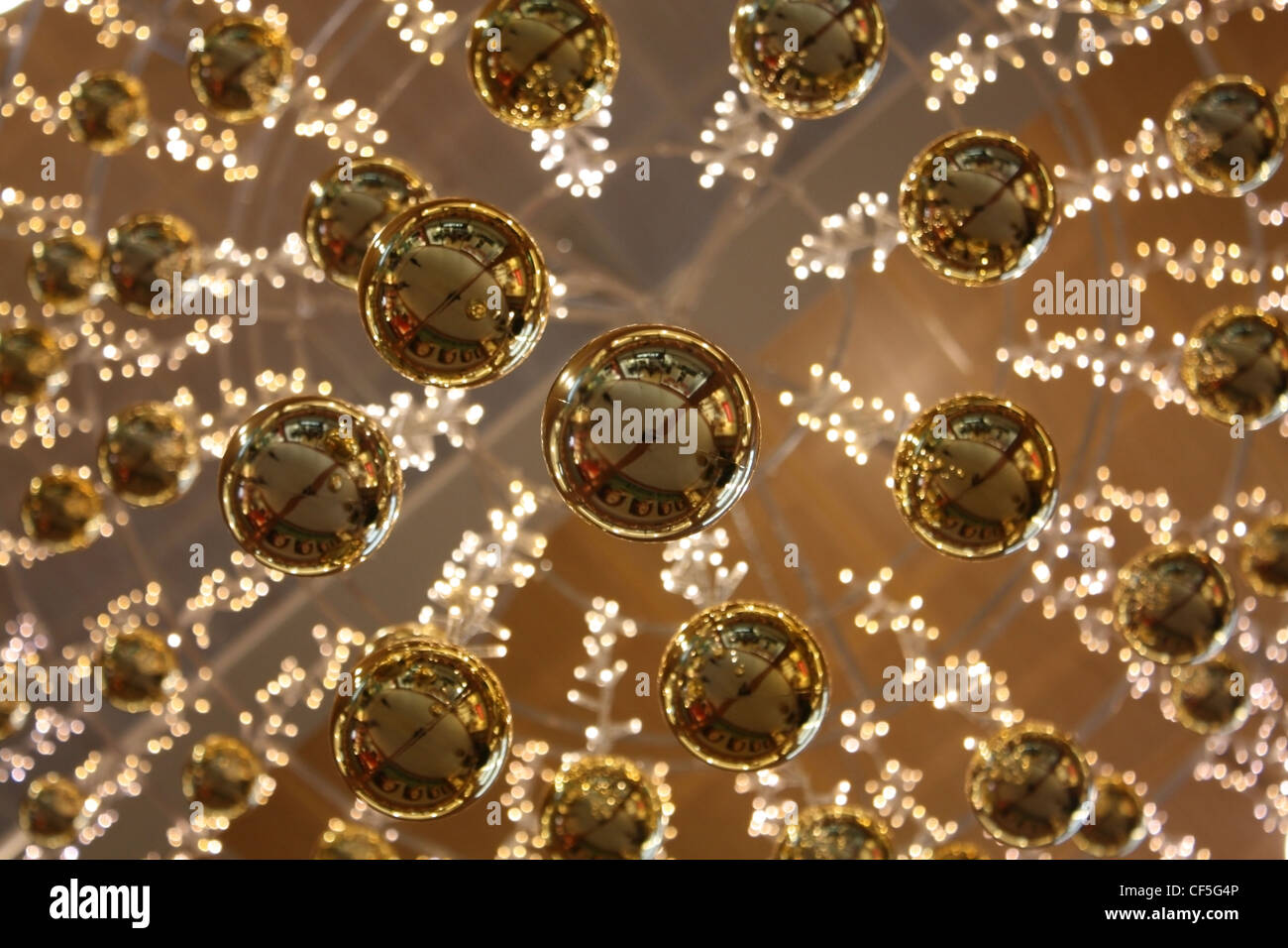 Christmas Ornaments Hanging From A Ceiling Stock Photo