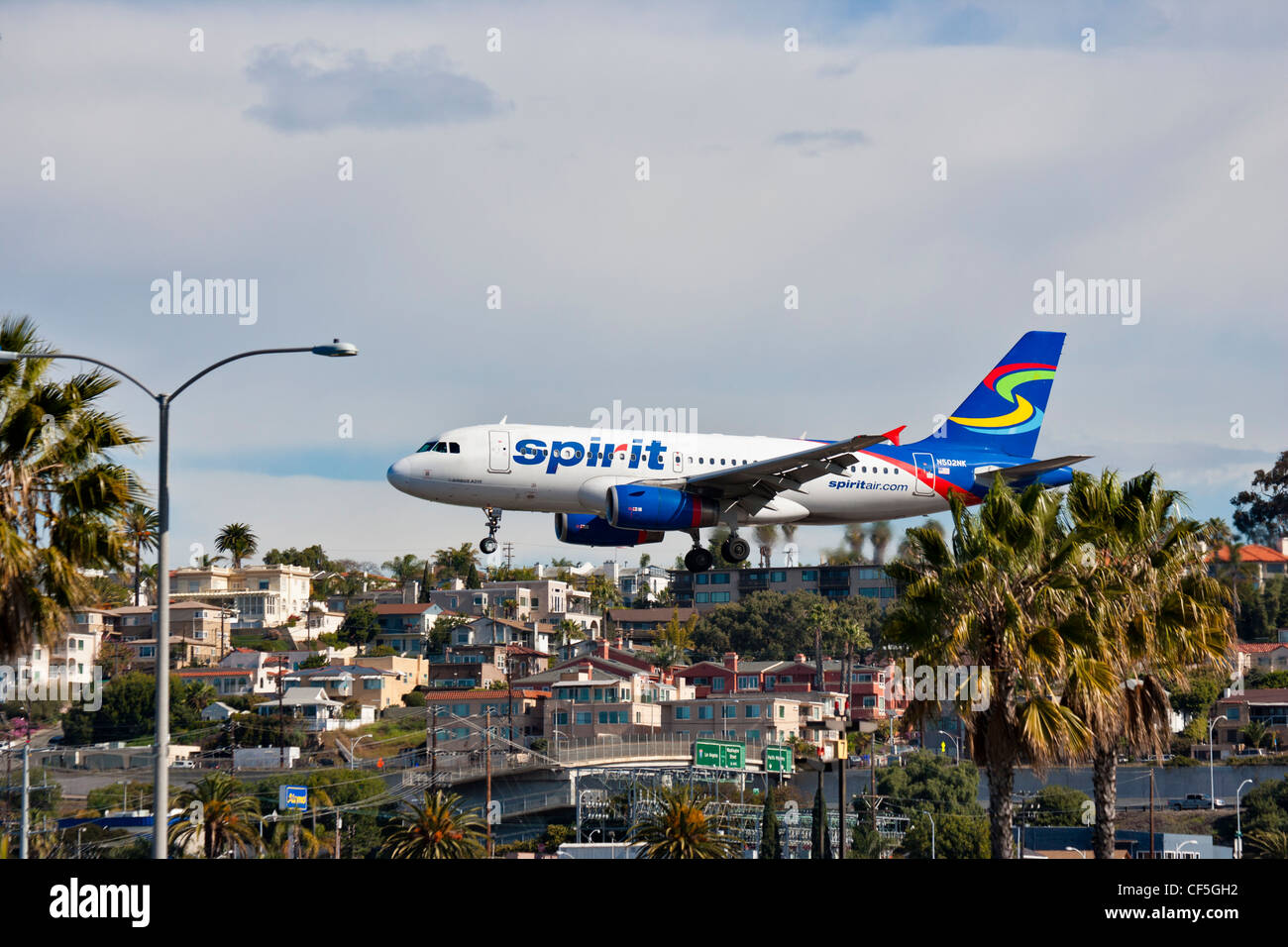 Jet airliner on final approach to Lindbergh field-San Diego, California, USA. Stock Photo