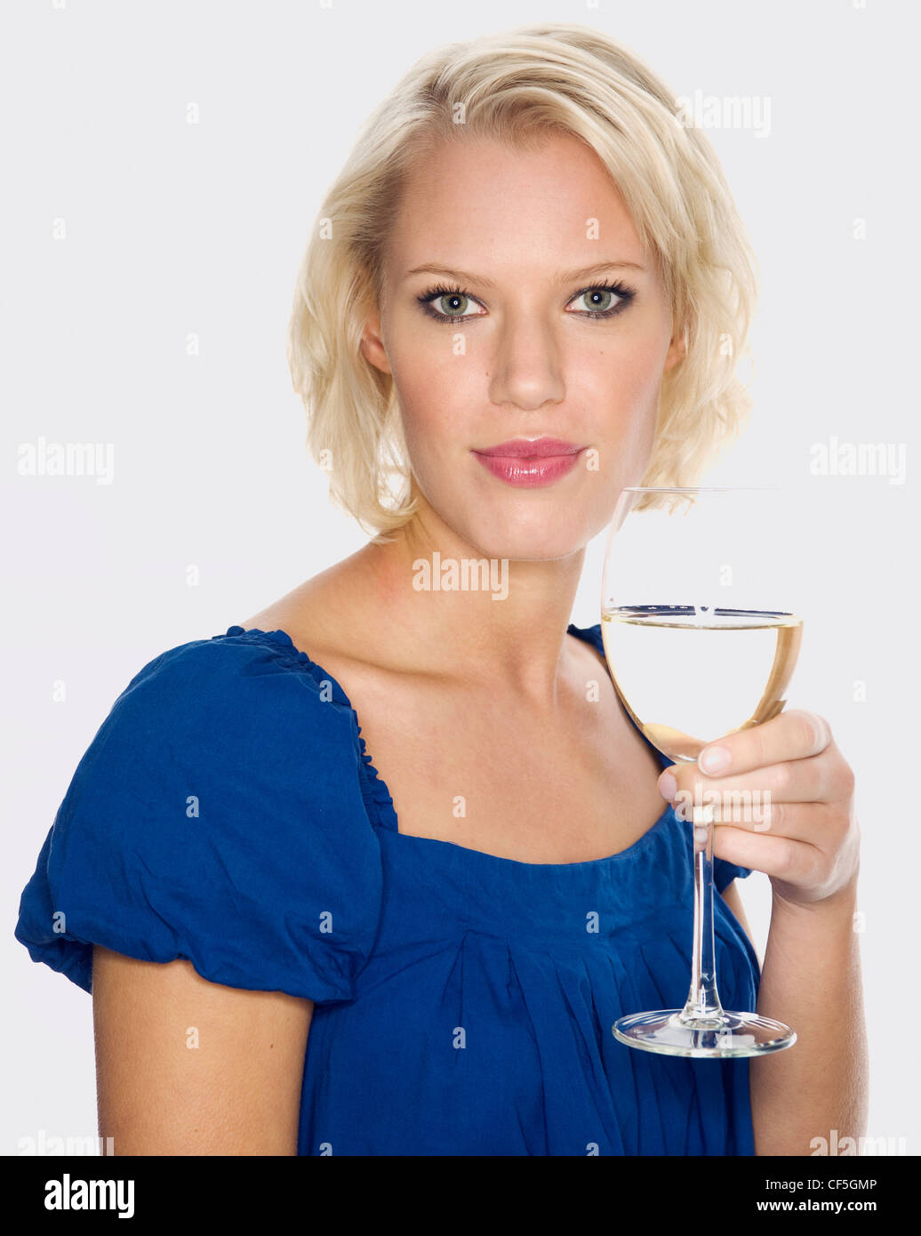 Female holding a glass of white wine Stock Photo - Alamy