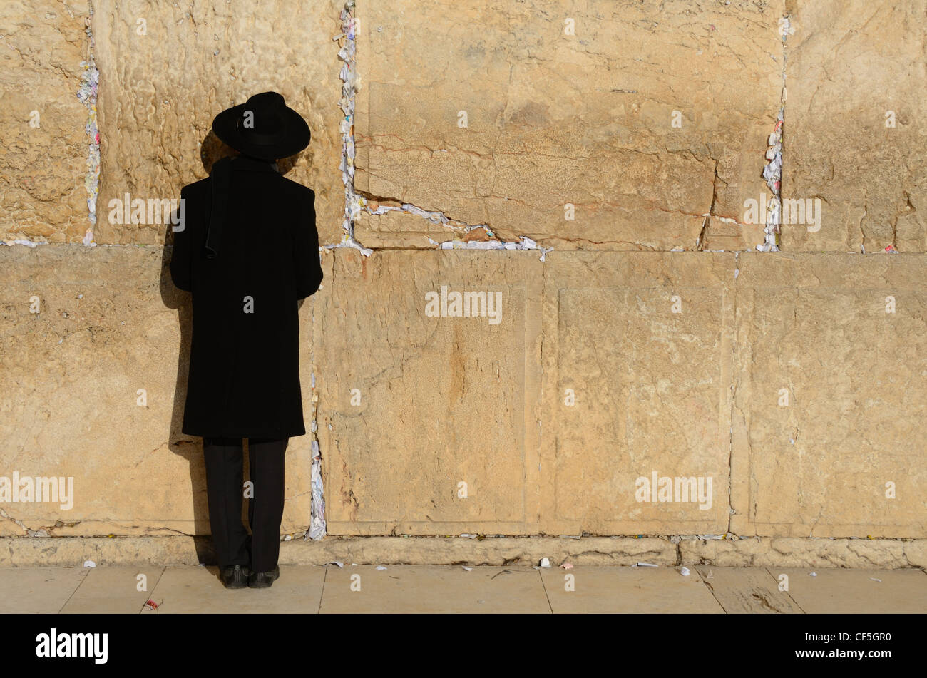 An Orthodox Jew prayers at the Western Wall in Jerusalem, Israel. Stock Photo