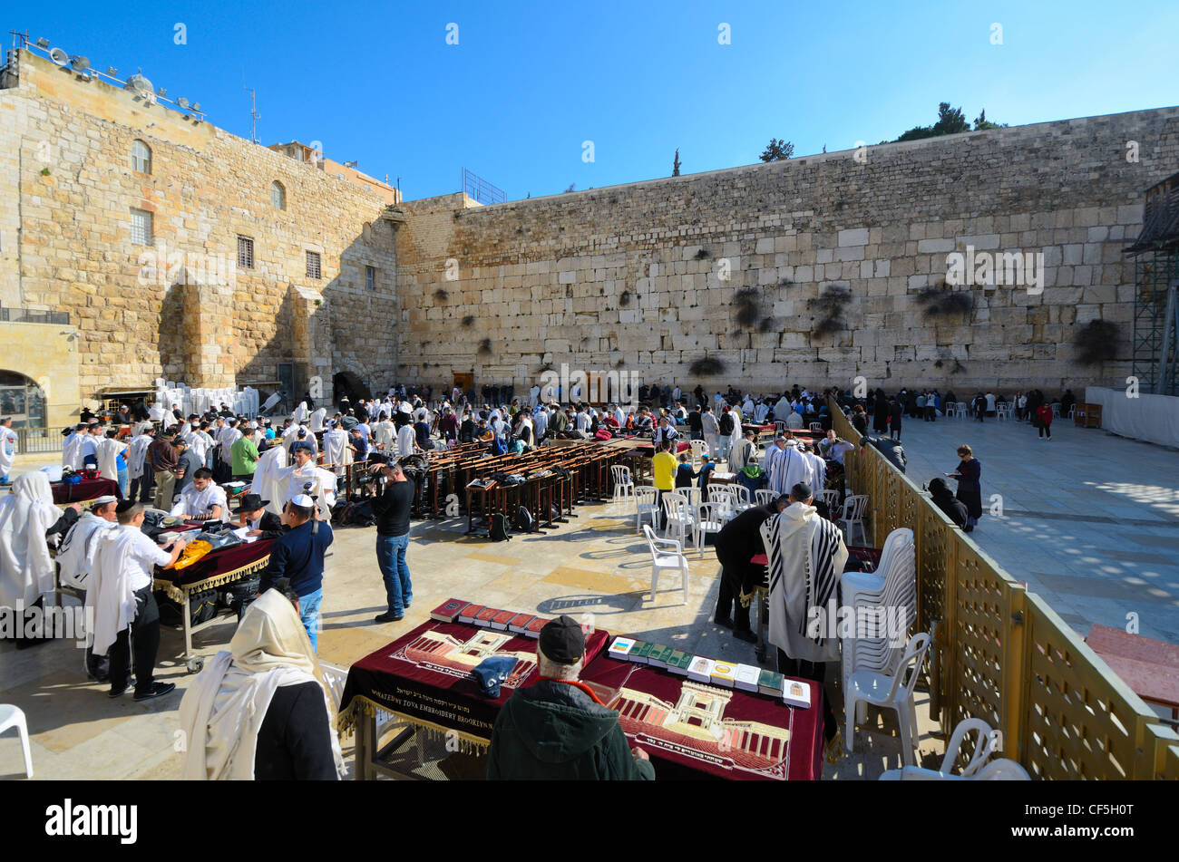 Crowds worship at the Western Wall, the holiest site in Judaism outside the Temple Mount itself in Jerusalem, Israel. Stock Photo