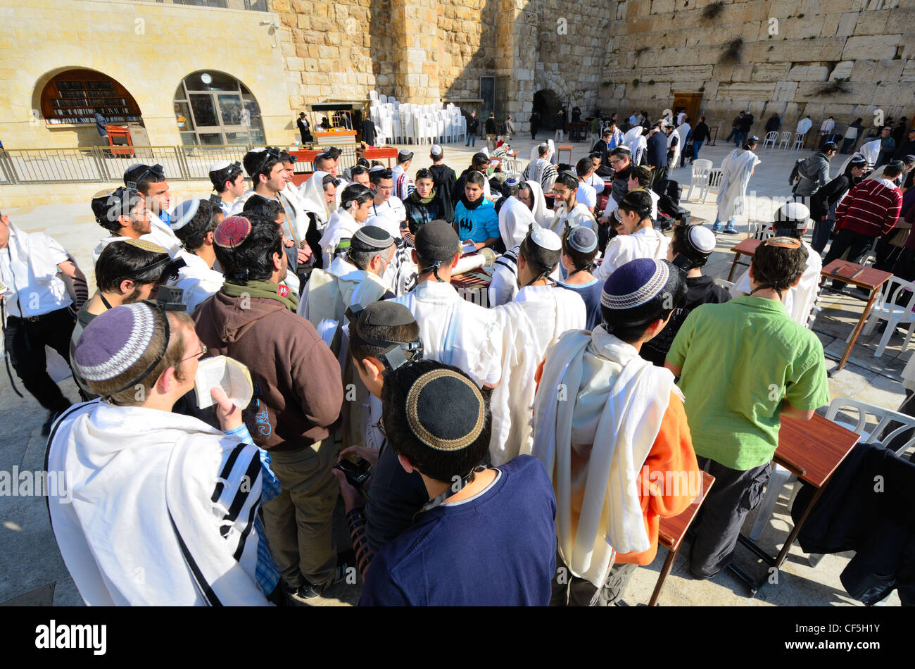 Crowds worship at the Western Wall, the holiest site in Judaism outside the Temple Mount itself in Jerusalem, Israel. Stock Photo