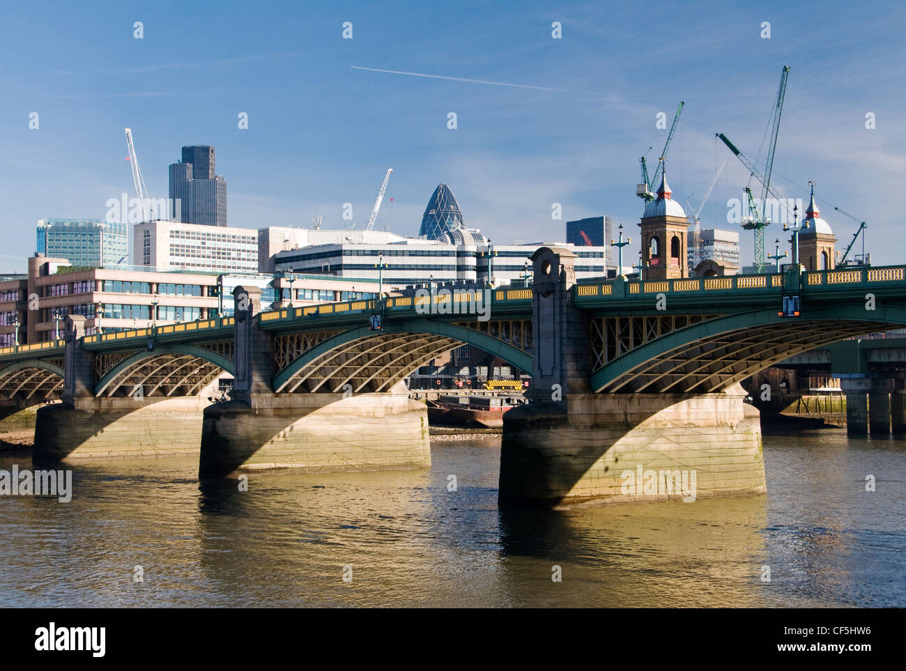 Southwark Bridge from the south bank of the River Thames. Stock Photo