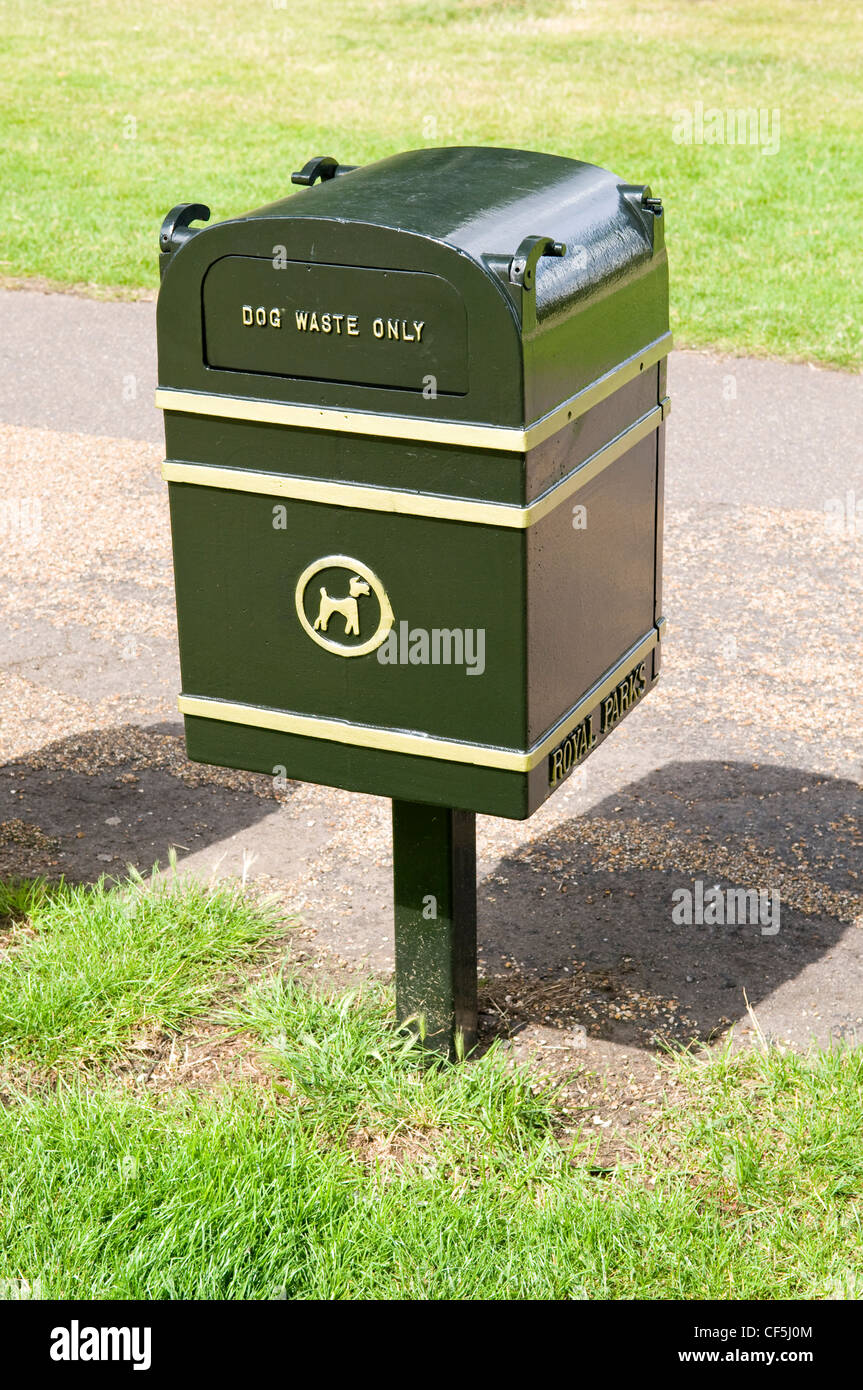 Close up of a green dog waste bin in Hyde Park. Stock Photo